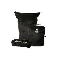 Product shot featuring Outdoor Vitals ultralight travel organization accessories, including a dry bag, a packing cube, and a zippered dopp kit pouch.
