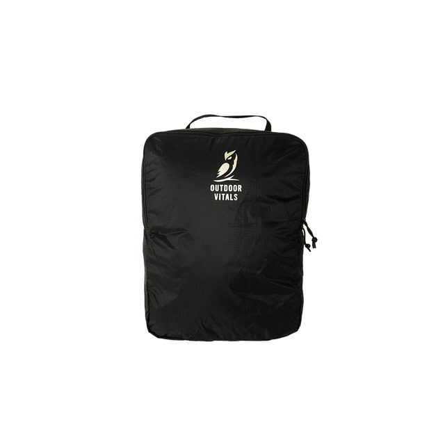 Studio product front view of the Outdoor Vitals OV Cube packing accessory for the KotaUL Travel & Adventure Backpack, featuring top grab handle and printed logo.