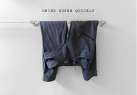 Outdoor Vitals Satu Adventure Pants hanging to dry on a rack.