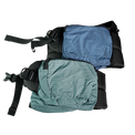 Product shot showing the detachable hip belt pockets of the Outdoor Vitals Shadowlight Carbon 60 Backpack, featuring durable ripstop grid fabric and zippered closures.