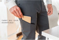 Close-up of the zippered thigh pocket on Outdoor Vitals Satu Adventure Pants storing a notebook.