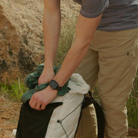 Packing the Nebo Windbreaker into a backpack