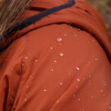 Close-up of the Outdoor Vitals Vario Jacket shoulder with water droplets beading on the fabric